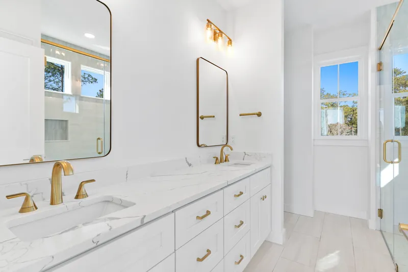 Double-vanity bathroom in the custom beach house in Southport, NC