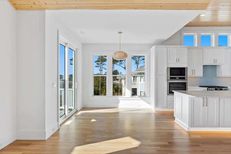 Open vaulted living and kitchen area in the custom coastal home in Southport, NC