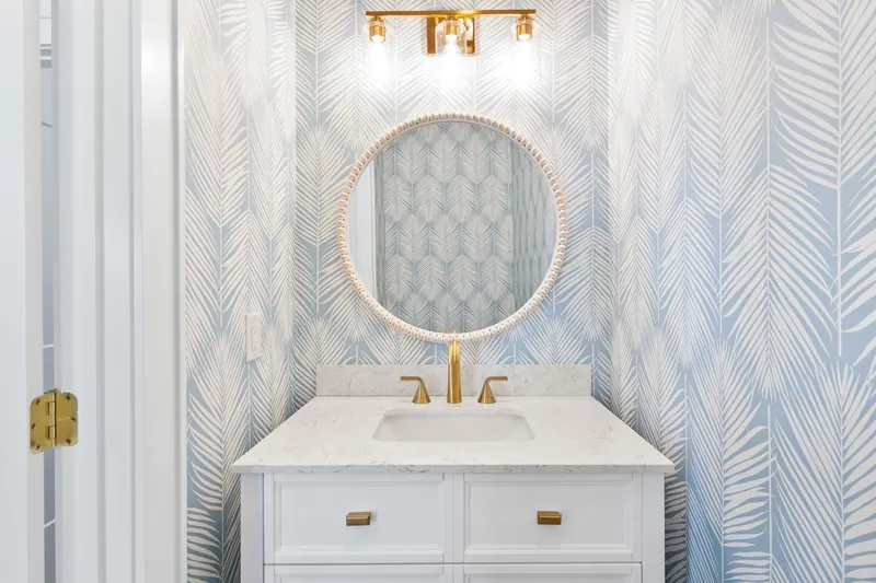 Marble vanity and bath finishes in the custom beach house in Southport, NC