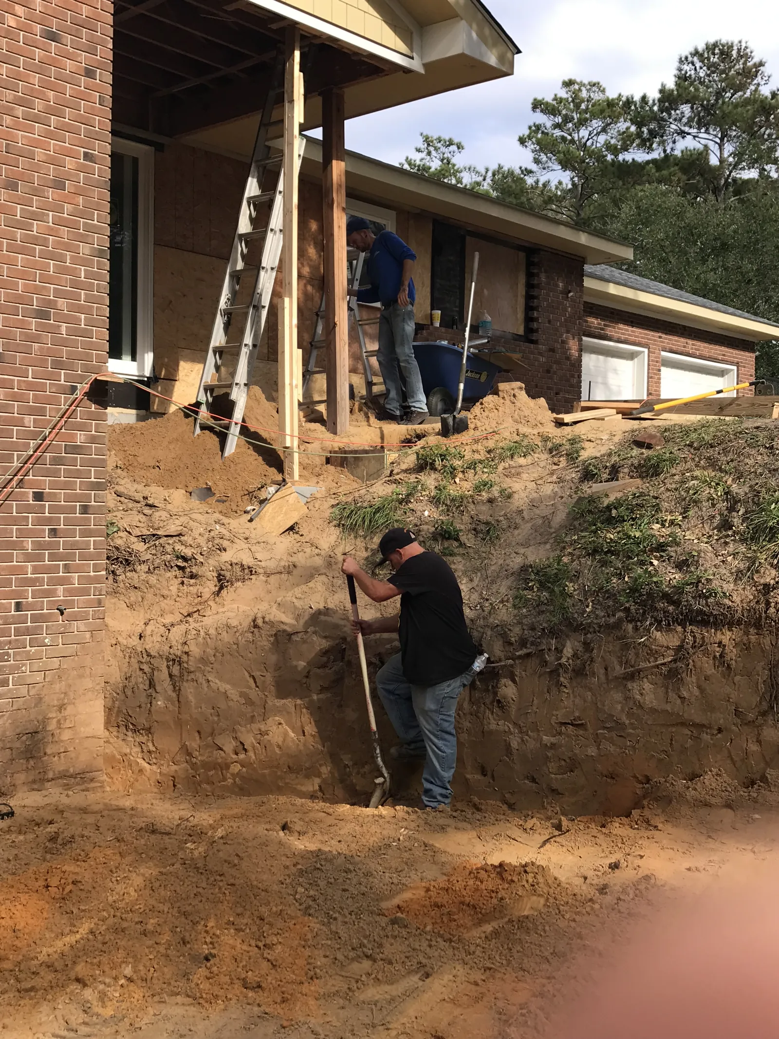 Builder on site working a brick custom home in Brunswick County, NC — collaboration-first construction by Northstar Custom Works