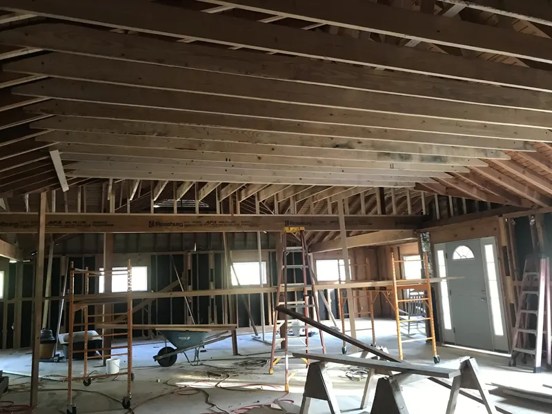 Dramatic interior framing and roof trusses on a custom home build near Oak Island, NC