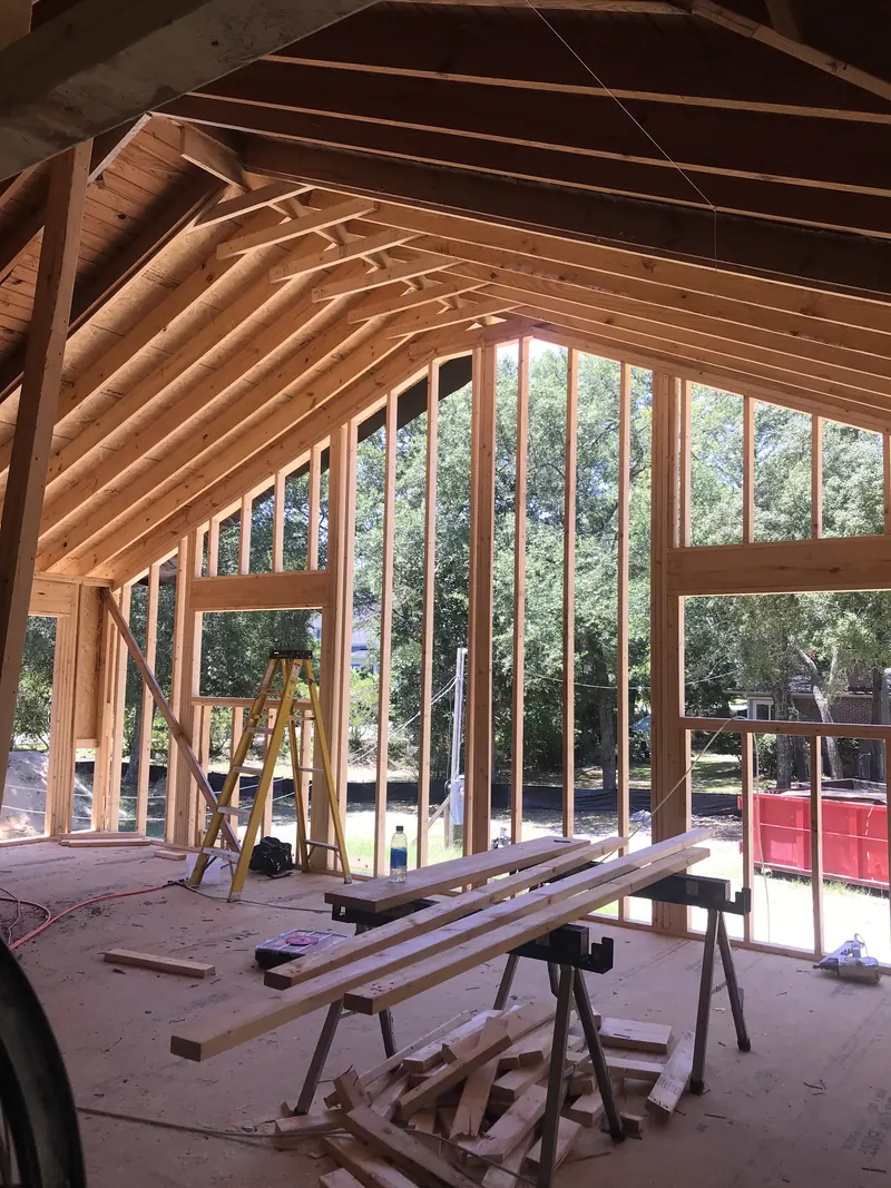 Vaulted wood-plank ceiling and millwork in a custom home near Oak Island, NC